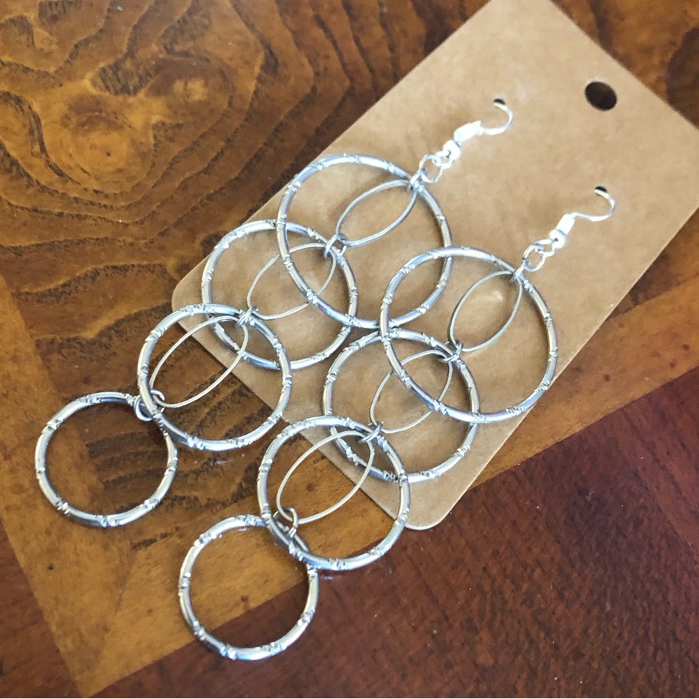 Shiny silver plated tiered textured ring dangle earrings